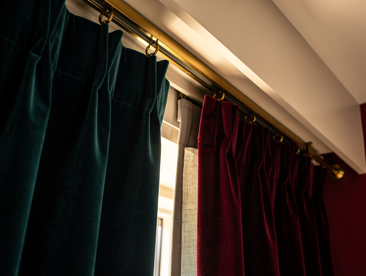 Realistic close-up editorial photo of a recessed ceiling curtain track disappear