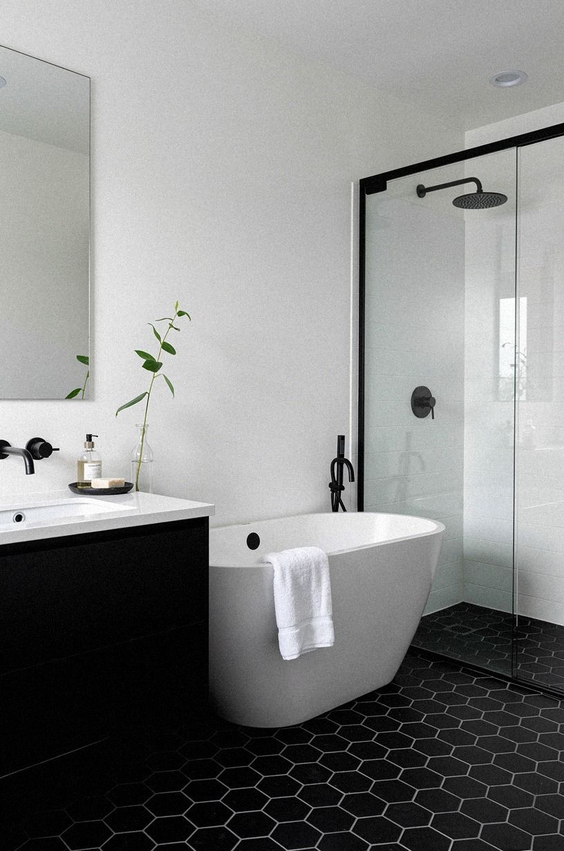 Soft White Above Black Tile: The small contrast that opened the ceiling