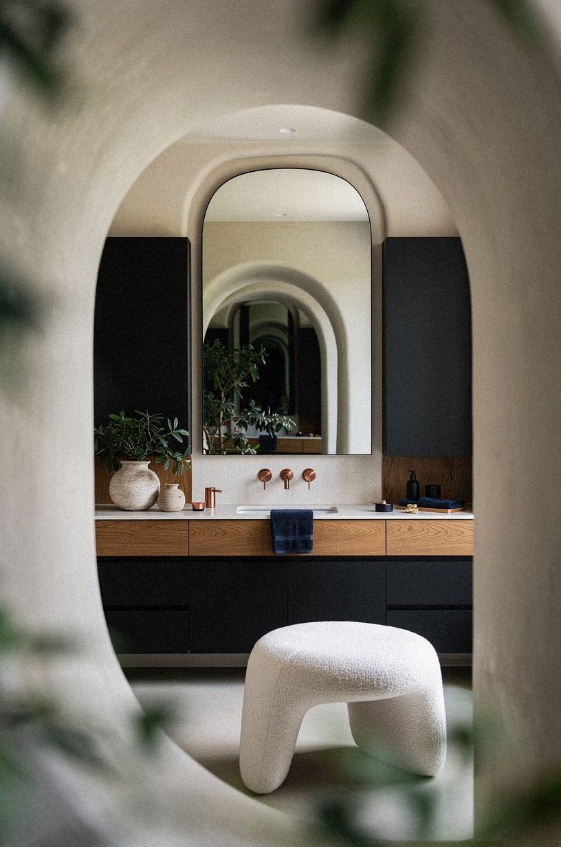 Layer black cabinetry with warm oak
