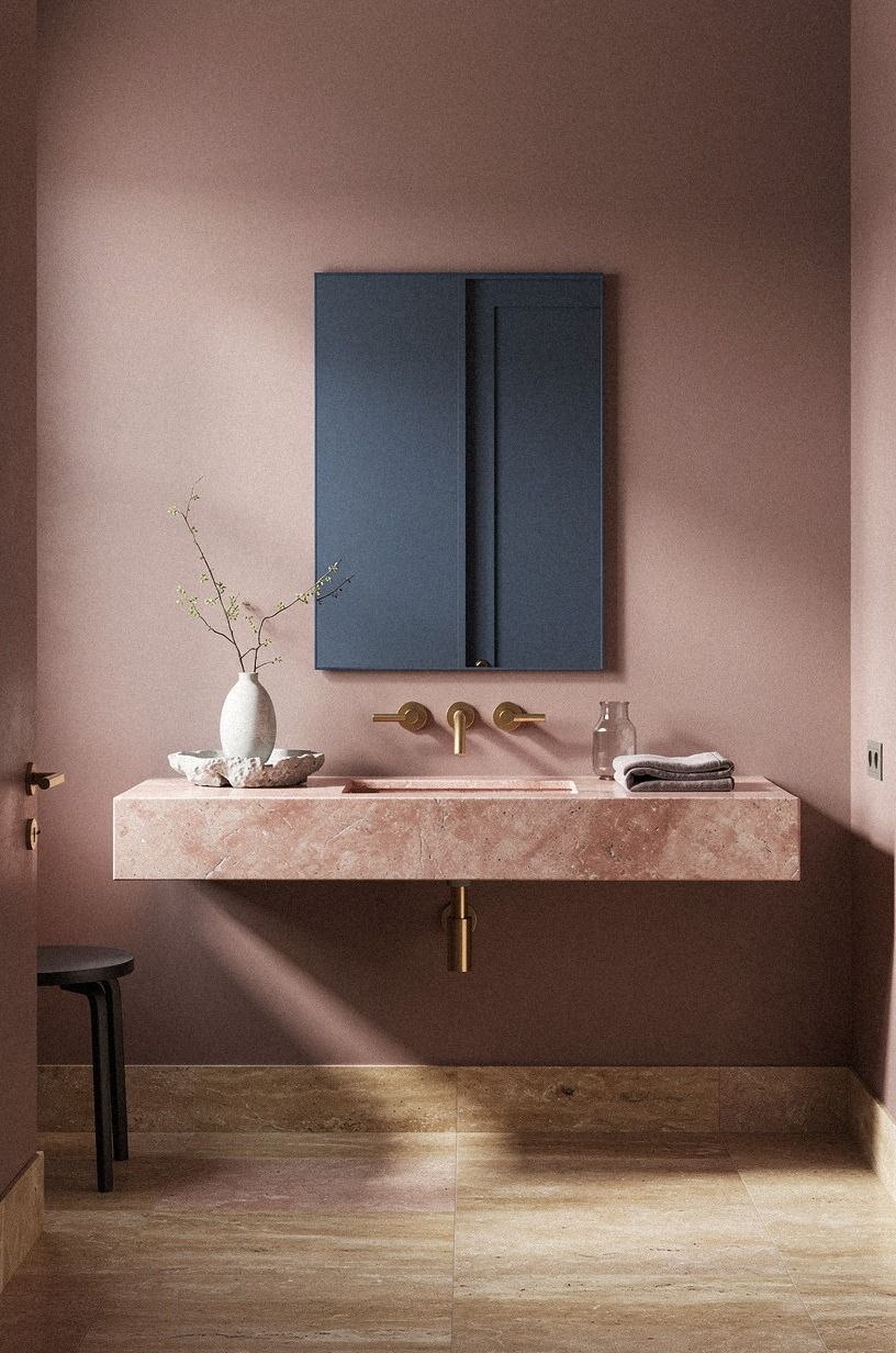 Float a pink stone vanity under a blue mirror