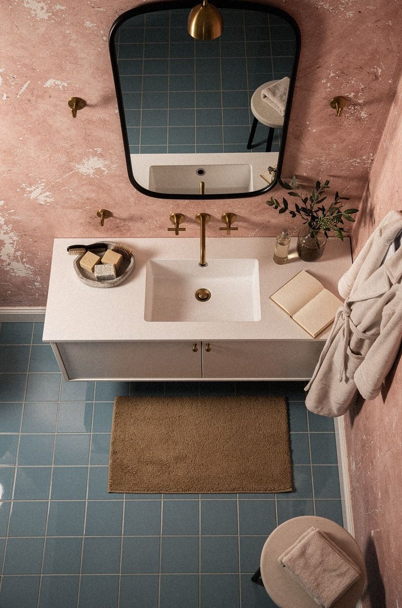 Mix tiffany blue bathroom tile with aged pink plaster