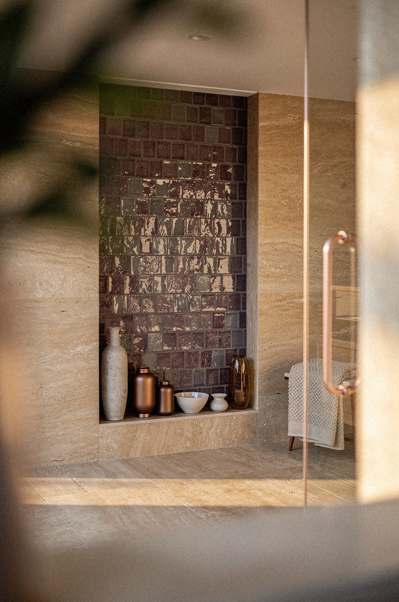 Choose hand-glazed tile for the shower niche