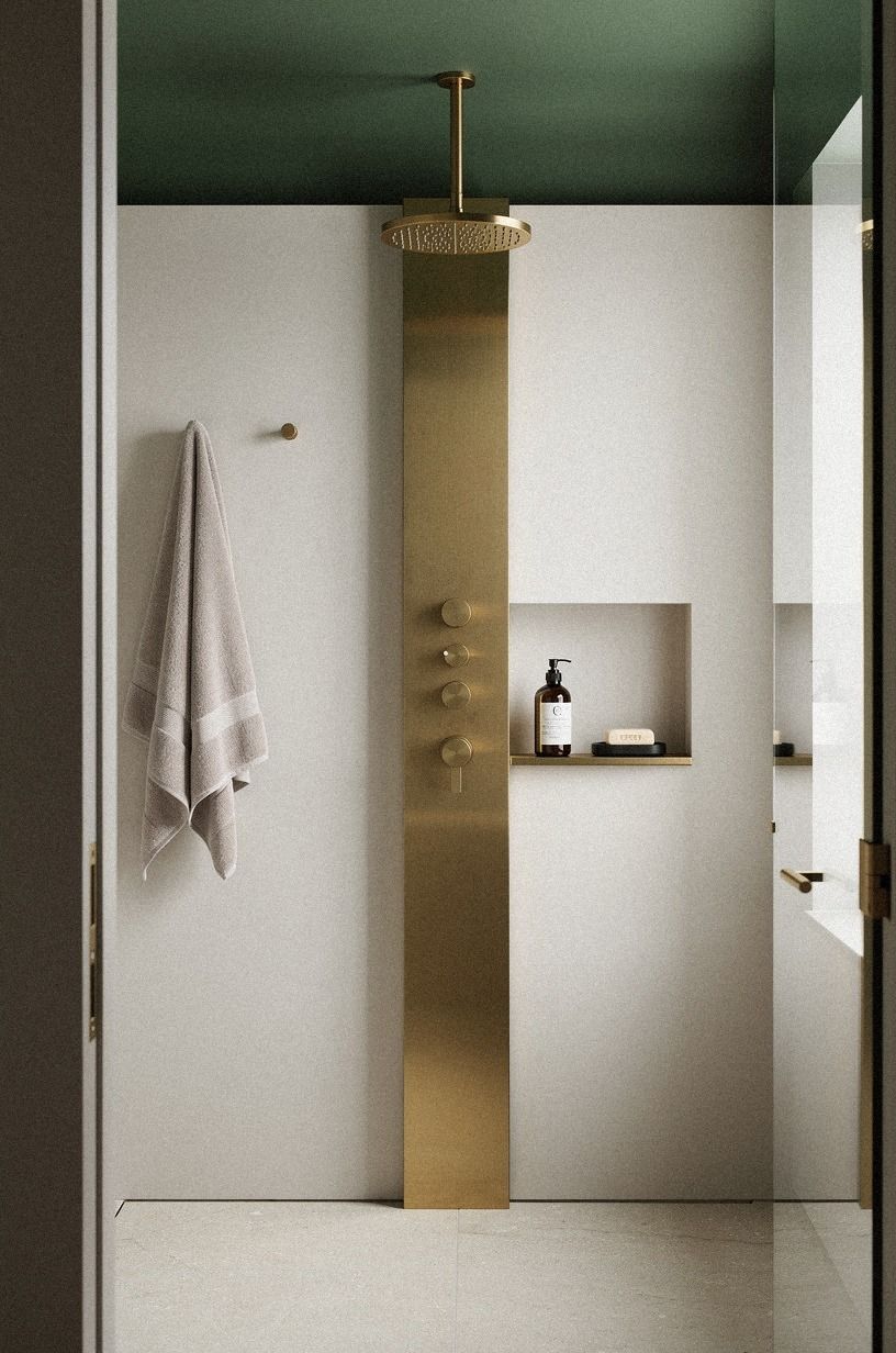 Frame the mirror with a warm metal reveal