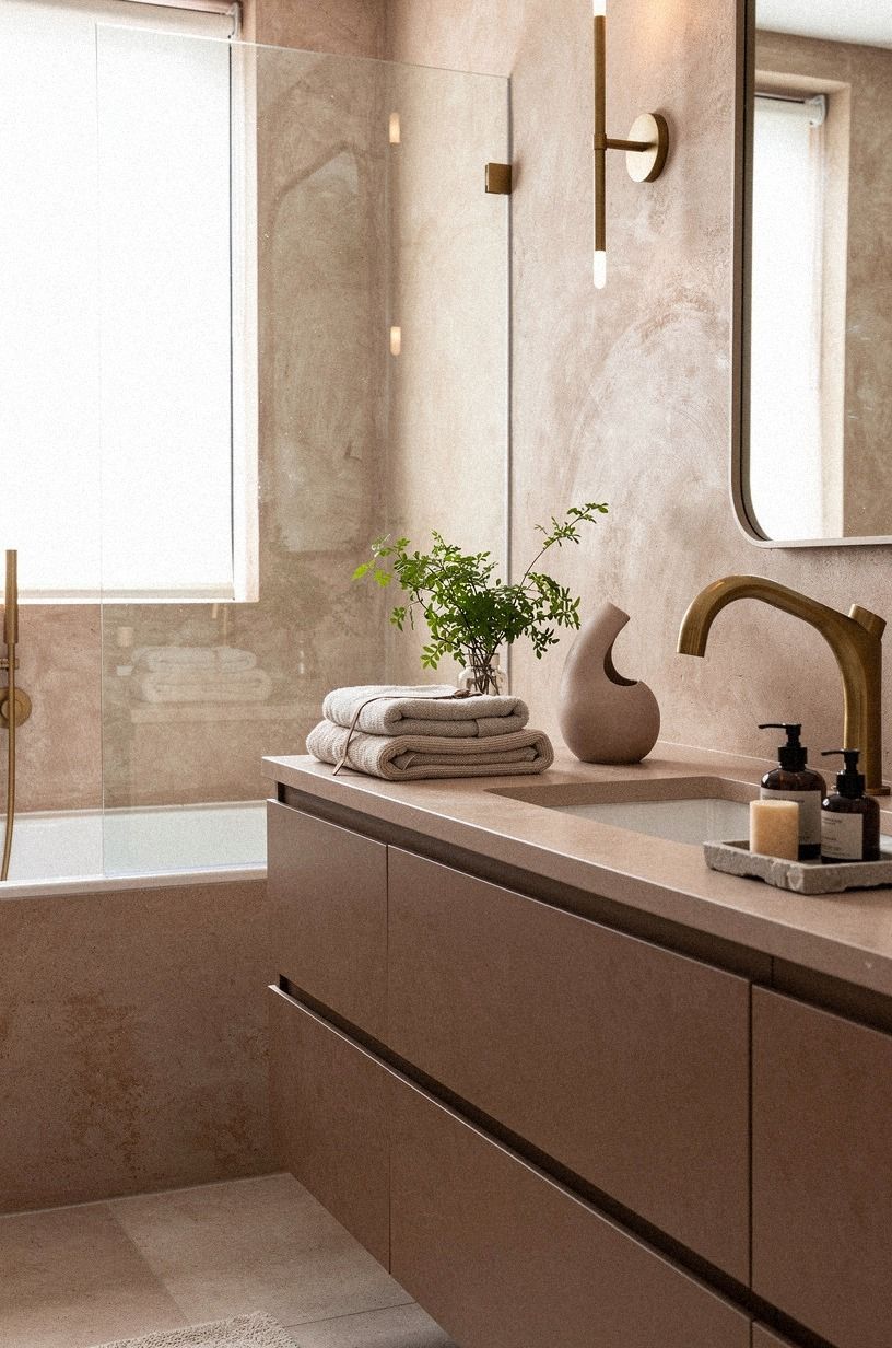 Add a sculptural faucet with brushed brass warmth