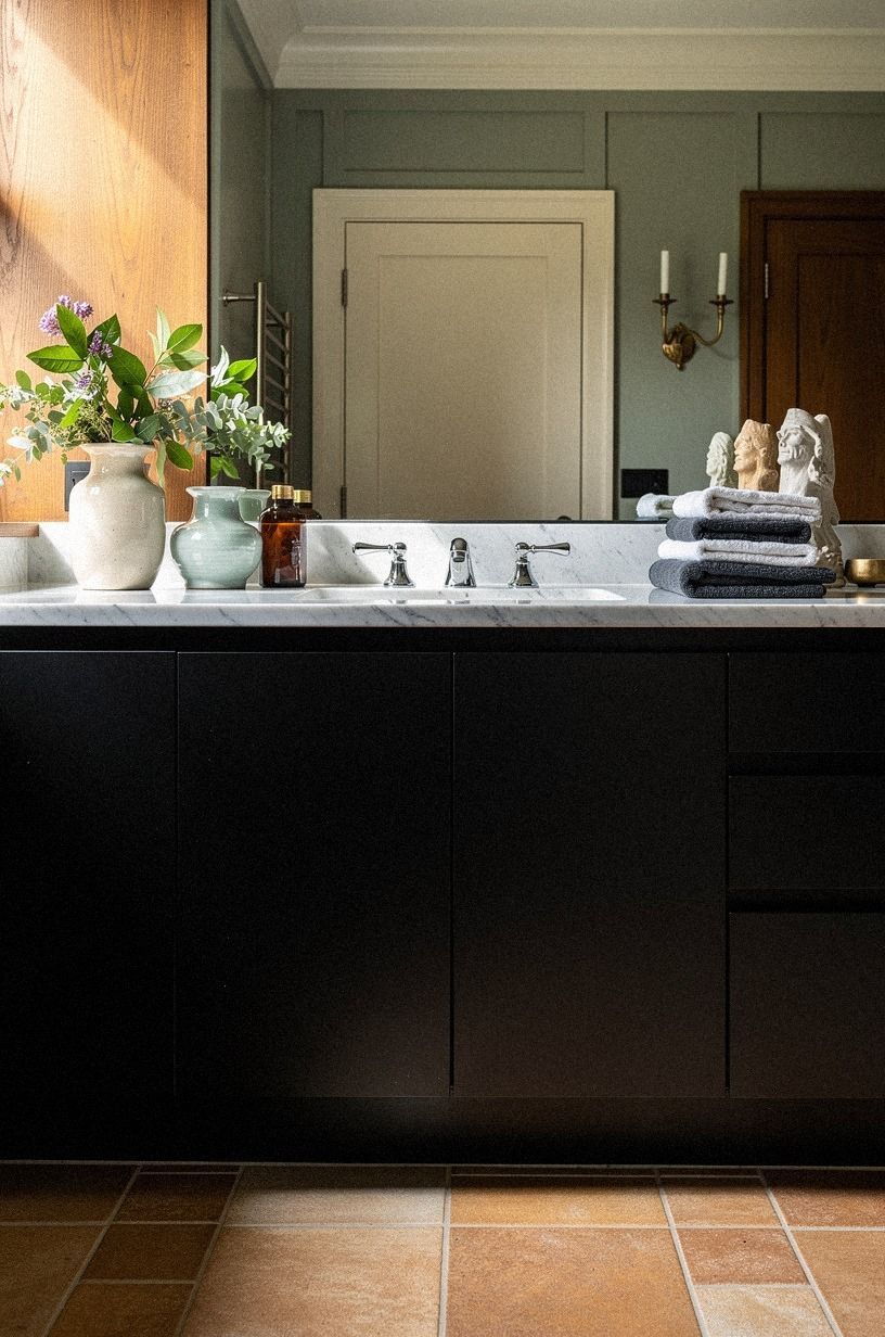 Place a black vanity over warm floor tile